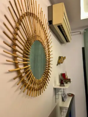 a mirror hanging on a wall in a room at Le Coup de cœur de Guéliz avec Piscine et Parking in Marrakech
