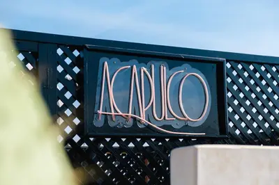 a sign that says acato on the side of a building at Riad Dar Davia - Jacuzzi Rooftop - Breakfast in Marrakech