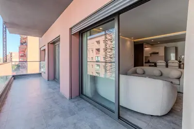 a view of a room with a large glass window at Bright and Stylish Apartment Center of Marrakech in Marrakech