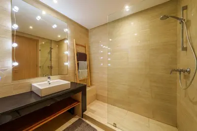 a bathroom with a sink and a shower at Spacious Luxury Apartment with Heated Pool Center in Marrakech