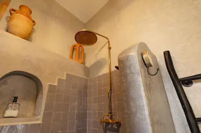 a bathroom with a shower with a sink and a shower at Riad Amaya in Marrakech