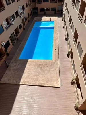a swimming pool in the middle of a building at Luxury apartment in Gueliz Marrakech in Marrakech