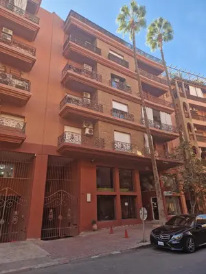 a building with a car parked in front of it at appartement hyper centre Gueliz in Marrakech
