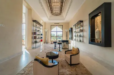 a lobby with chairs and tables and a ceiling at Palais Les Orchidées - Villa de Luxe à 15 minutes du Centre in Marrakech