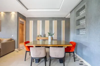 a dining room with a table and chairs at Heavenly Setting at Prestigia Pool in Marrakech