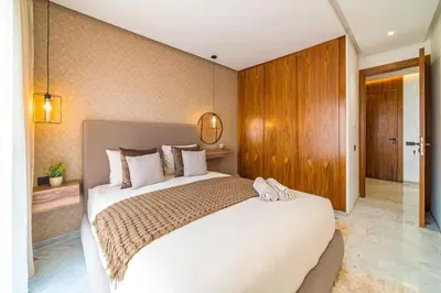 a bedroom with a large white bed in a room at Cute and Modern in Heart of Downtown in Marrakech