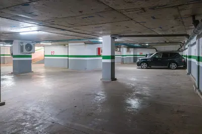 an empty parking garage with a car parked in it at Cute and Modern in Heart of Downtown in Marrakech
