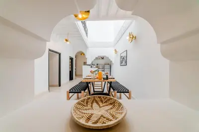 a dining room with a table and chairs at Riad Ines 10mn to Place with Breakfast in Marrakech