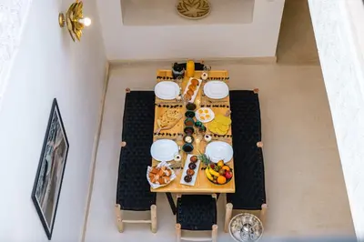 an overhead view of a table with food on it at Riad Ines 10mn to Place with Breakfast in Marrakech