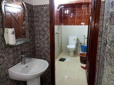 a bathroom with a sink and a toilet at Spacious Apt - Near Airport - Perfect for Groops! in Marrakech