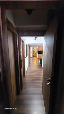 a hallway of a house with wooden floors and doors at Elegant room in luxury apartment Gueliz in Marrakech
