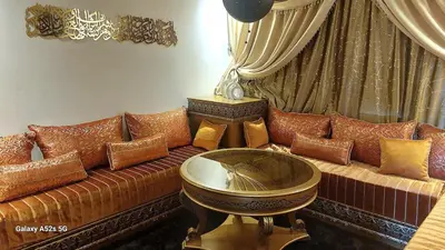 a living room with a couch with many pillows at Elegant room in luxury apartment Gueliz in Marrakech