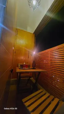a table in a room with a light on it at Elegant room in luxury apartment Gueliz in Marrakech