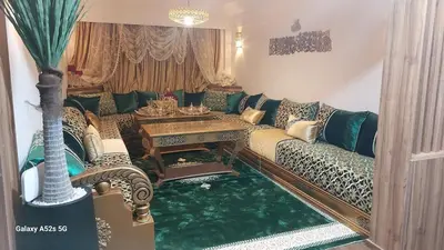 a living room with a couch and a table at Elegant room in luxury apartment Gueliz in Marrakech