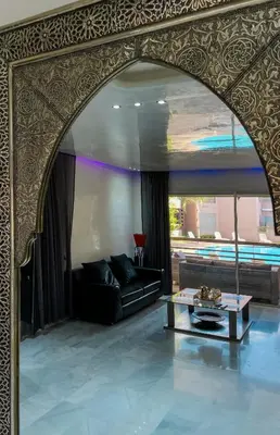 a living room with a couch and a table at Luxury Appartement in Marrakech