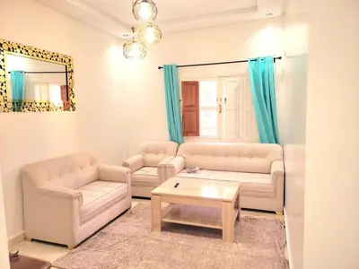 a living room with two couches and a coffee table at Authentic stay 2 in Marrakech Comfort & Charm in Marrakech
