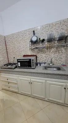 a kitchen counter with a microwave and a sink at Authentic stay 2 in Marrakech Comfort & Charm in Marrakech