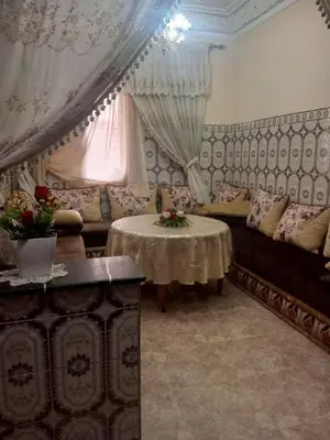 a living room with a couch and a table at Large 1-Bed Apt, Perfect for You! in Marrakech