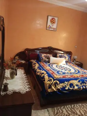 a bedroom with a bed with a colorful blanket at Large 1-Bed Apt, Perfect for You! in Marrakech