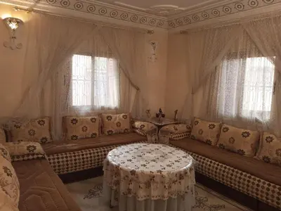 a living room with a couch and a table at Large 1-Bed Apt, Perfect for You! in Marrakech