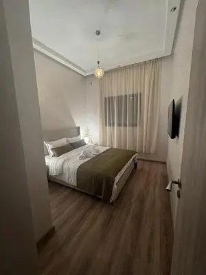 a bedroom with a large bed in a room at IMMOB Zak in Marrakech