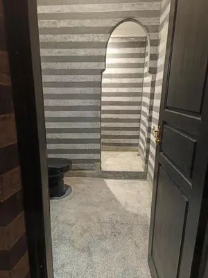 a door leading into a room with a toilet at Riad Palais Bahia - Entire House - 5 Bedrooms in Marrakech