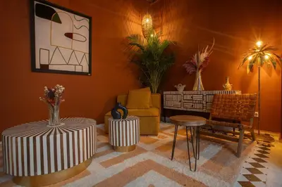 a living room with a couch and a table and chairs at Riad Tassili Boutique in Marrakech