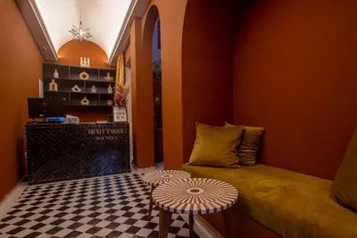 a small room with a bed and a table at Riad Tassili Boutique in Marrakech