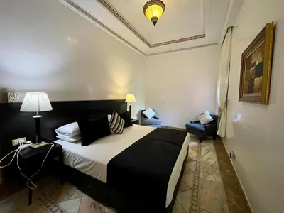 a bedroom with a large bed in a room at Appartement à Marrakech in Marrakech