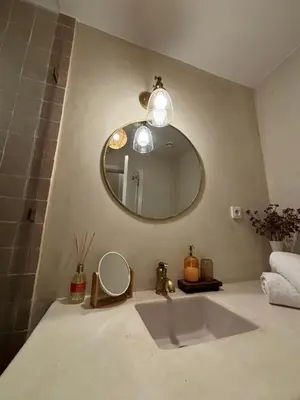 a bathroom with a sink and a mirror on the wall at Dar Sawan - Beautiful 2rooms & terrace at Atlas golf Palmeraie in Marrakech