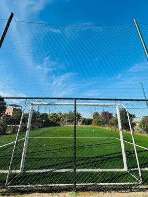 a soccer goal with a field in the background at Dar Sawan - Beautiful 2rooms & terrace at Atlas golf Palmeraie in Marrakech