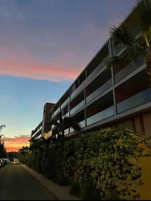 a building on the side of a street at sunset at Perl garden in Marrakech