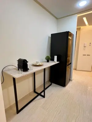 a desk with a black refrigerator in an office at T1 Chic & Bright in Marrakech in Marrakech