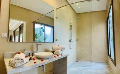 a bathroom with a sink and a mirror at Hala Luxury Domain in Marrakech