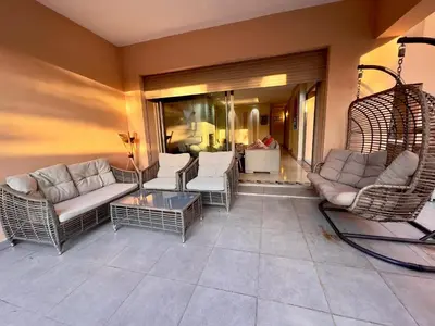 a living room with couches and chairs and a table at فيلا فاخرة في مراكش مع حديقة خاصة ومسبح - تجربة استرخاء لا تُنسى in Marrakech