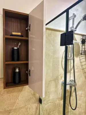 a shower with a glass door in a bathroom at City Haven at Pearl Garden Pool and View in Marrakech