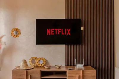a television on a wall above a wooden table at City Haven at Pearl Garden Pool and View in Marrakech