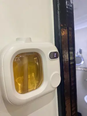 a bathroom door with a small television on the wall at Modern central apartment 2 bedrooms in Marrakech