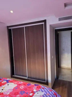 a bedroom with a large sliding glass door at Sublime appartement au coeur de Marrakech in Marrakech