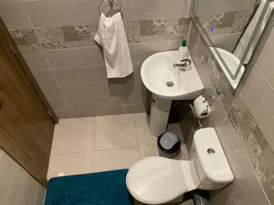 a small bathroom with a toilet and a sink at Location appartement a Marrakech aboib gulez in Marrakech