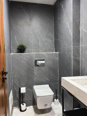 a bathroom with a toilet and a sink at Royal CinemaBedroom Gueliz Center in Marrakech