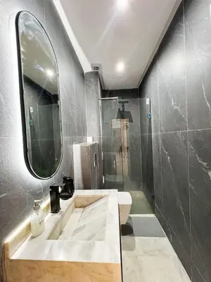 a bathroom with a sink and a mirror at Luxe Studio Gueliz in Marrakech