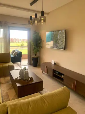 a living room with a couch and a coffee table at prestigia agate apt haut standing meublé in Marrakech