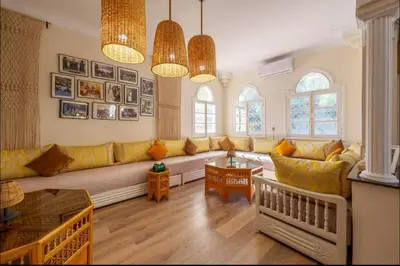 a living room with a couch and a table at Palais Rhize targa in Marrakech