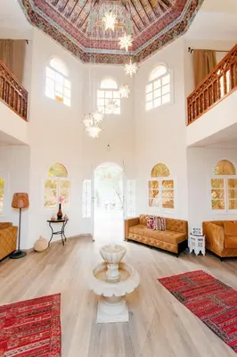 a large living room with a couch and a table at Palais Rhize targa in Marrakech