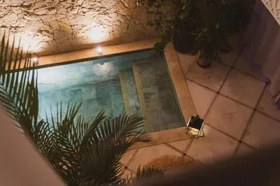 an overhead view of a swimming pool in a house at Riad Yuna in Marrakech