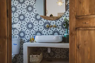 a bathroom with a sink and a mirror at Riad Yuna in Marrakech