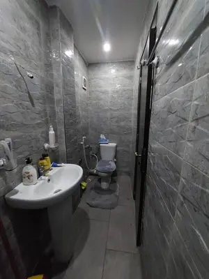 a bathroom with a sink and a toilet at Furnished apartment close to the city center in Marrakech