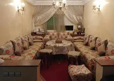 a large living room with a couch and a table at appartement meuble in Marrakech