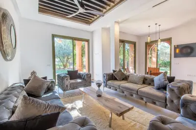 a living room with couches and a coffee table at Luxe et Detente Haut standing Piscine in Marrakech